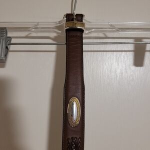 Men's brown leather belt with silver and gold accents